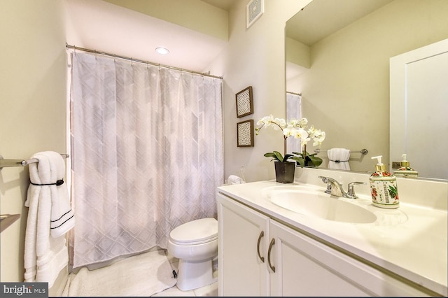 full bathroom featuring vanity, toilet, tile patterned floors, and curtained shower