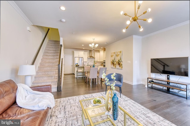 living area featuring a chandelier, dark wood-style floors, stairway, crown molding, and baseboards