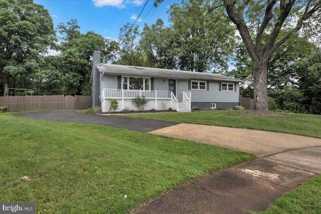907 Sterling Ct, Herndon, VA 20170 - ranch-style home with asphalt driveway, covered porch, and a chimney