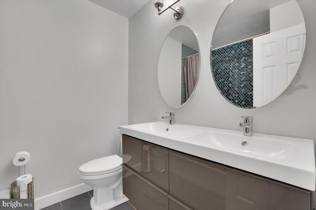 907 Sterling Ct, Herndon, VA 20170 - bathroom with toilet, tile patterned flooring, double vanity, and baseboards