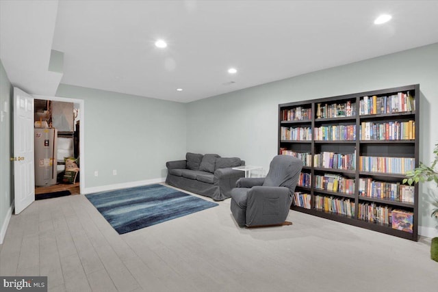 907 Sterling Ct, Herndon, VA 20170 - sitting room featuring water heater, baseboards, recessed lighting, and wood finished floors
