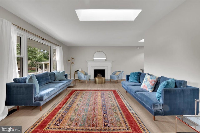 907 Sterling Ct, Herndon, VA 20170 - living area with a skylight, wood finished floors, and a fireplace