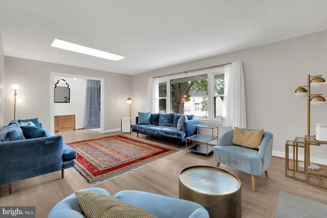 907 Sterling Ct, Herndon, VA 20170 - living area featuring wood finished floors, baseboards, and a skylight