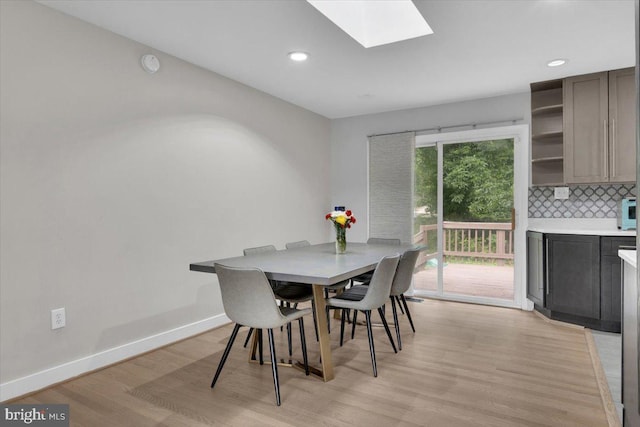 907 Sterling Ct, Herndon, VA 20170 - dining space with light wood-type flooring, recessed lighting, a skylight, and baseboards