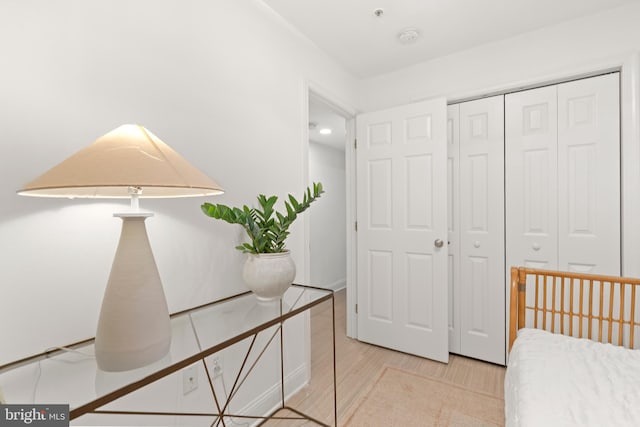 bedroom featuring a closet and wood finished floors