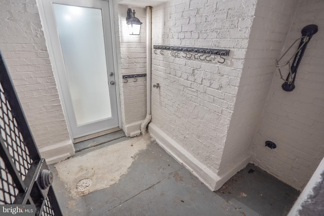 bathroom with unfinished concrete flooring