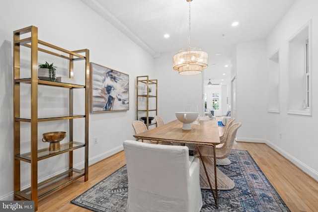 dining room with wood finished floors, recessed lighting, a chandelier, and baseboards