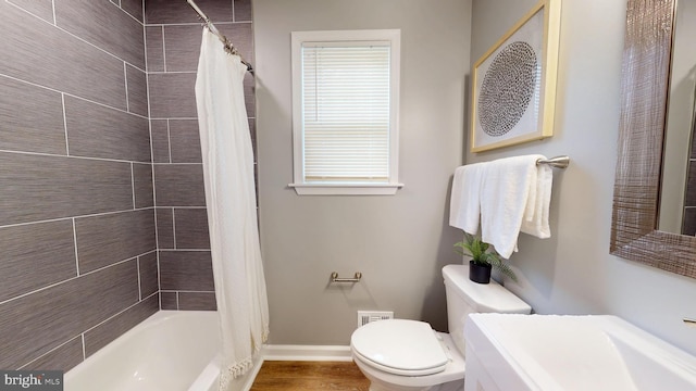 724 Overbrook Rd, Baltimore, MD 21212 - full bathroom featuring toilet, baseboards, shower / tub combo with curtain, and wood finished floors