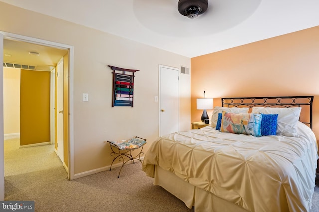 bedroom with carpet and baseboards