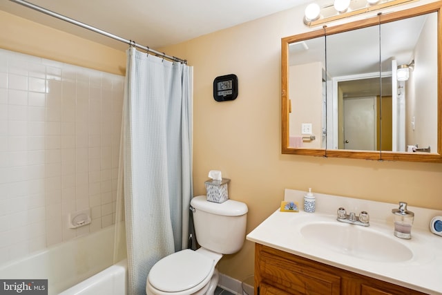 full bathroom featuring toilet, vanity, and shower / bathtub combination with curtain