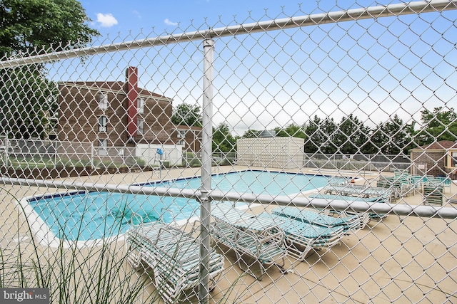 community pool featuring fence