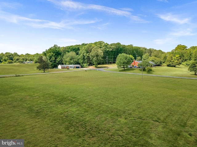view of property's community with a lawn