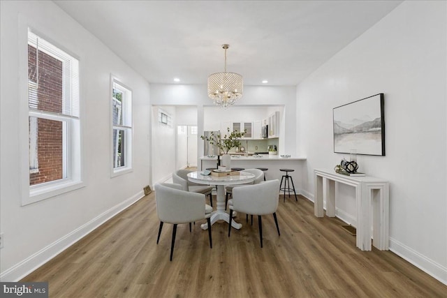 1160 Jackson St, Camden, NJ 08104 - dining area featuring a chandelier, wood finished floors, baseboards, and recessed lighting
