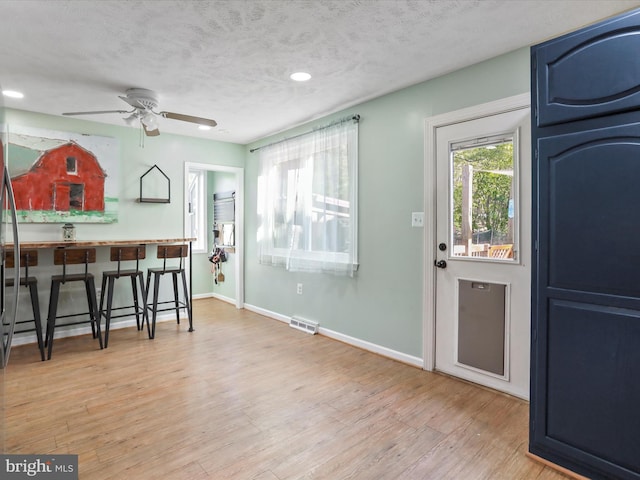 55 Powell Ln, Front Royal, VA 22630 - kitchen featuring blue cabinets, wood finished floors, a ceiling fan, baseboards, and recessed lighting