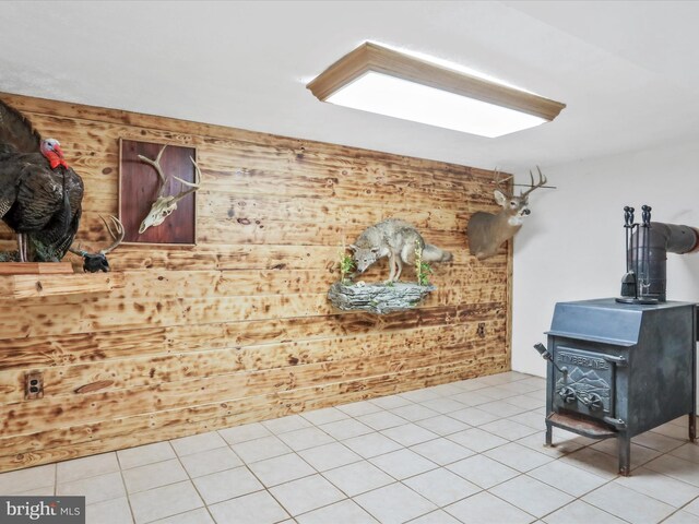 55 Powell Ln, Front Royal, VA 22630 - living room with a wood stove, wooden walls, and tile patterned floors