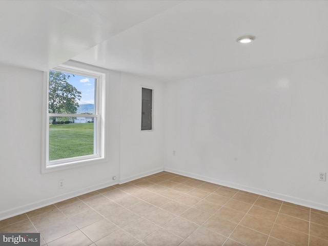 55 Powell Ln, Front Royal, VA 22630 - empty room featuring electric panel, baseboards, light tile patterned flooring, and a water view
