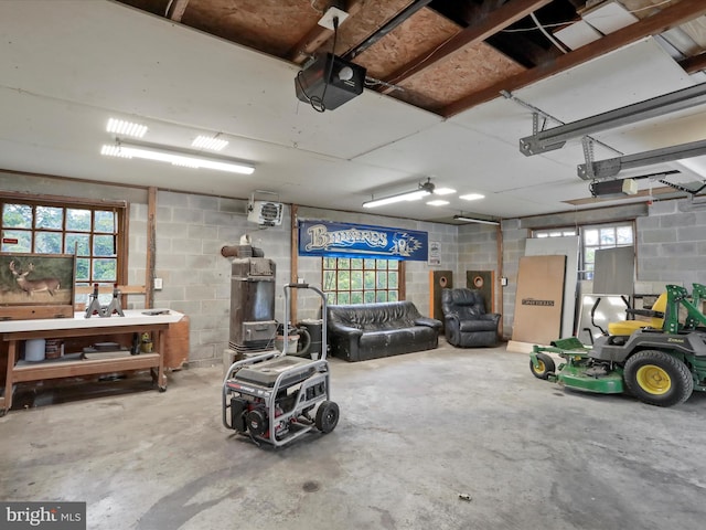 55 Powell Ln, Front Royal, VA 22630 - garage featuring a garage door opener and concrete block wall
