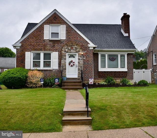 7340 Hasbrook Ave, Philadelphia, PA 19111 - view of front of property with brick siding, a chimney, and roof with shingles