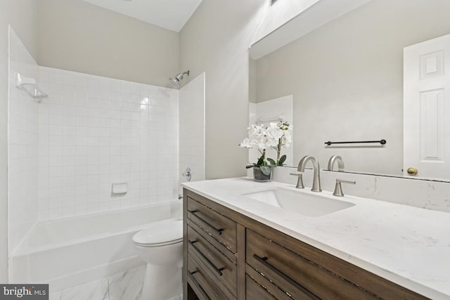 bathroom with toilet, tub / shower combination, vanity, and marble look tile flooring