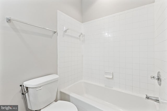 bathroom with toilet and  shower combination