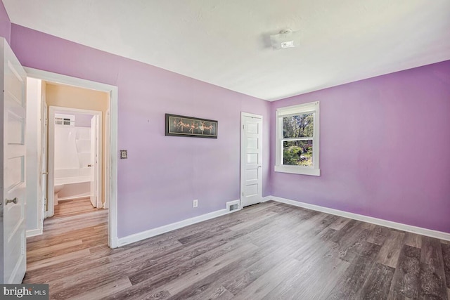 9425 Washington Blvd, Lanham, MD 20706 - empty room with wood finished floors and baseboards