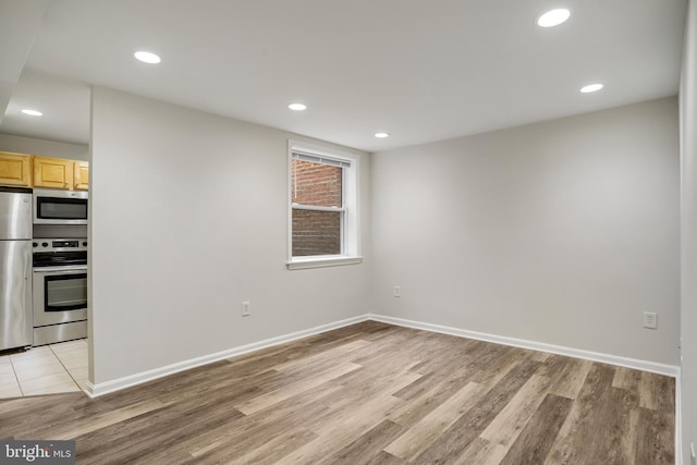 1030 Fairmont St NW Unit T2, Washington, DC 20001 - unfurnished room featuring light wood-style floors, recessed lighting, and baseboards