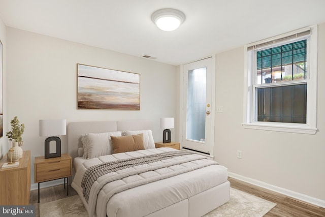 1030 Fairmont St NW Unit T2, Washington, DC 20001 - bedroom featuring wood finished floors and baseboards