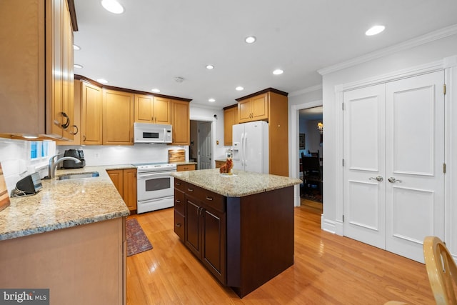 205 Hitching Post Dr, Wilmington, DE 19803 - kitchen with white appliances, ornamental molding, a sink, recessed lighting, and a center island