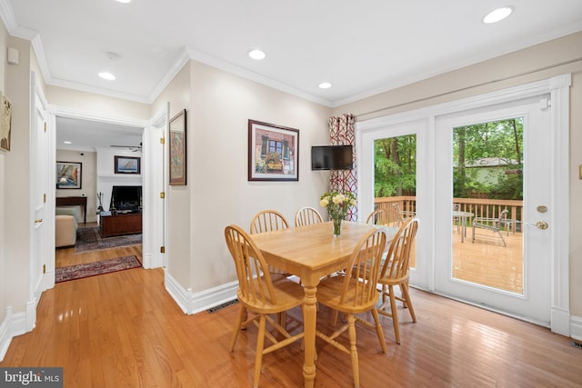 205 Hitching Post Dr, Wilmington, DE 19803 - dining room featuring light wood-style flooring, baseboards, ornamental molding, a fireplace, and recessed lighting