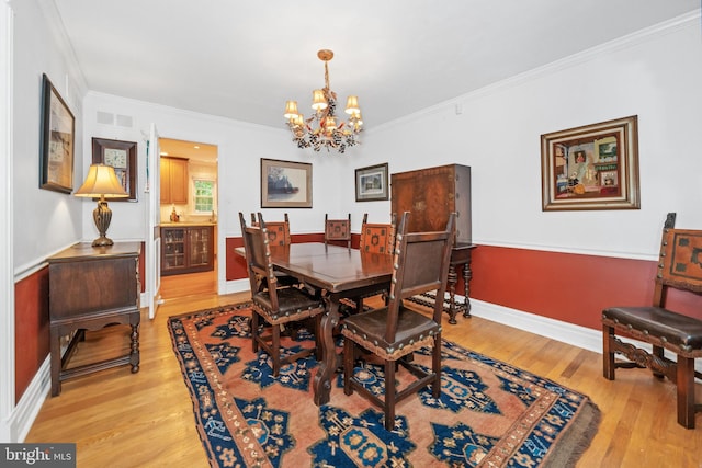 205 Hitching Post Dr, Wilmington, DE 19803 - dining space with a chandelier, light wood-style floors, ornamental molding, and baseboards