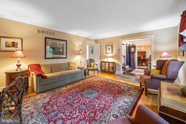 205 Hitching Post Dr, Wilmington, DE 19803 - living area with wood finished floors, a chandelier, crown molding, and baseboards