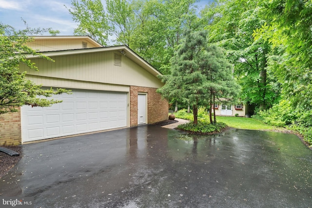 205 Hitching Post Dr, Wilmington, DE 19803 - view of side of property featuring brick siding and asphalt driveway