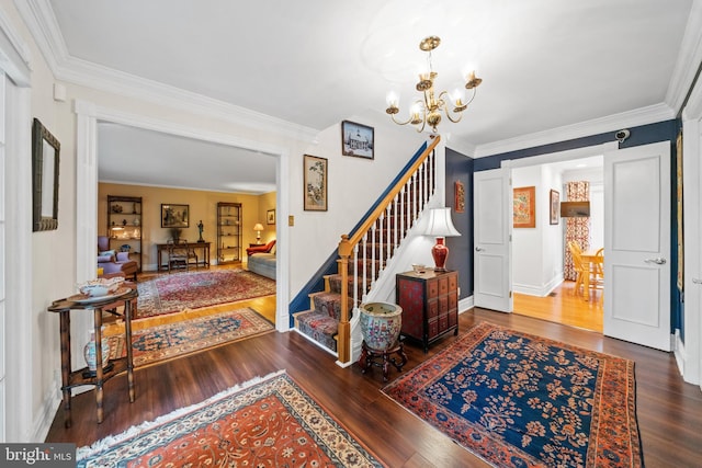205 Hitching Post Dr, Wilmington, DE 19803 - foyer entrance with a chandelier, stairs, wood finished floors, crown molding, and baseboards