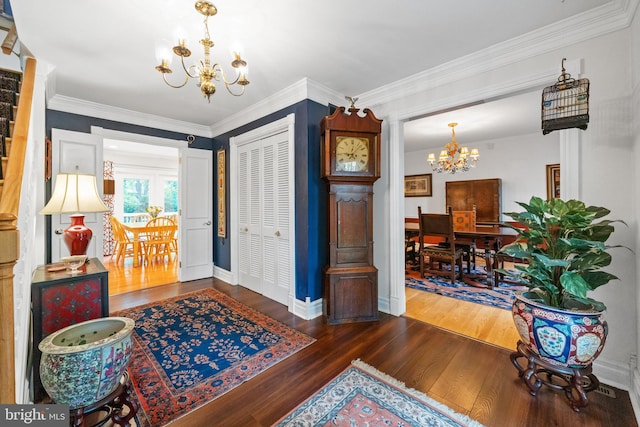 205 Hitching Post Dr, Wilmington, DE 19803 - foyer with a chandelier, wood finished floors, baseboards, and ornamental molding