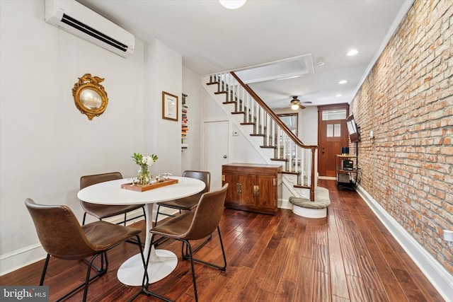 3182 Miller St, Philadelphia, PA 19134 - dining area with a wall mounted AC, stairs, baseboards, a wood stove, and brick wall