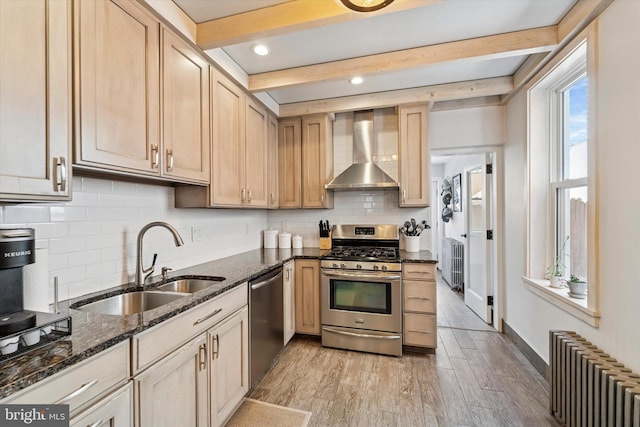 3182 Miller St, Philadelphia, PA 19134 - kitchen featuring radiator, wall chimney range hood, appliances with stainless steel finishes, a sink, and beamed ceiling