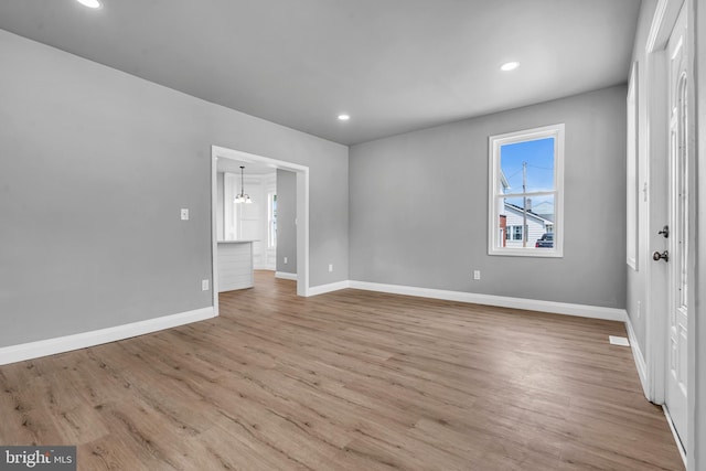 19 E Main St, Salem, NJ 08079 - spare room with baseboards, wood finished floors, recessed lighting, and a chandelier