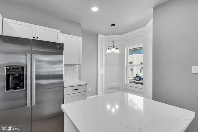 19 E Main St, Salem, NJ 08079 - kitchen with stainless steel fridge, a chandelier, white cabinetry, recessed lighting, and hanging light fixtures