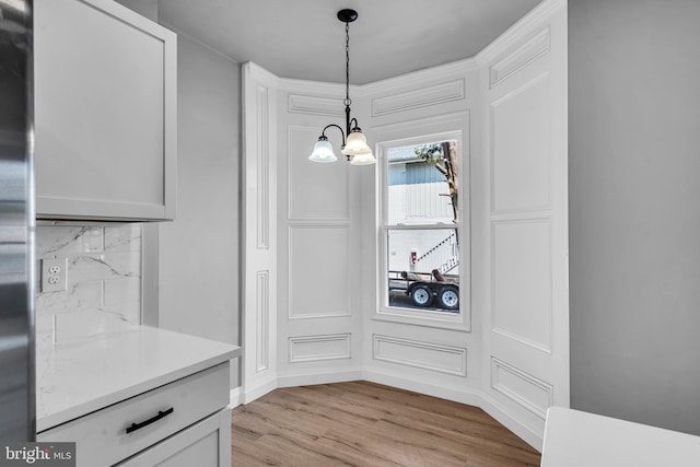 19 E Main St, Salem, NJ 08079 - unfurnished dining area with a chandelier and light wood finished floors