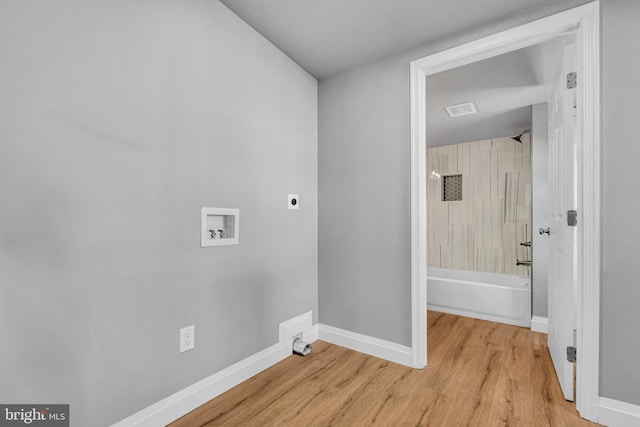 19 E Main St, Salem, NJ 08079 - washroom featuring hookup for a washing machine, hookup for an electric dryer, baseboards, and light wood-style floors