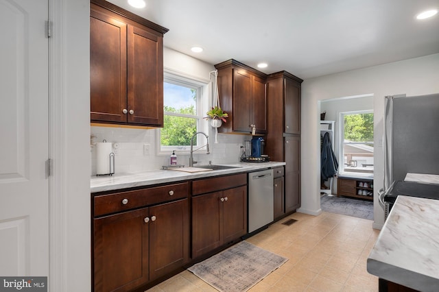 63 W Hanover St, Gettysburg, PA 17325 - kitchen with a sink, stainless steel dishwasher, plenty of natural light, tasteful backsplash, and recessed lighting