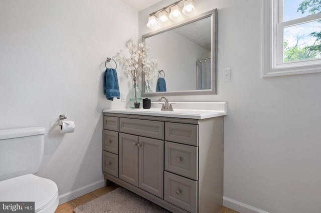 63 W Hanover St, Gettysburg, PA 17325 - full bath with toilet, baseboards, tile patterned floors, and vanity