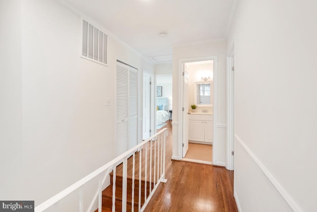 hallway with light wood-style floors