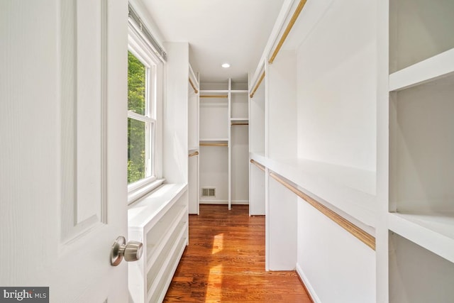 spacious closet featuring wood finished floors