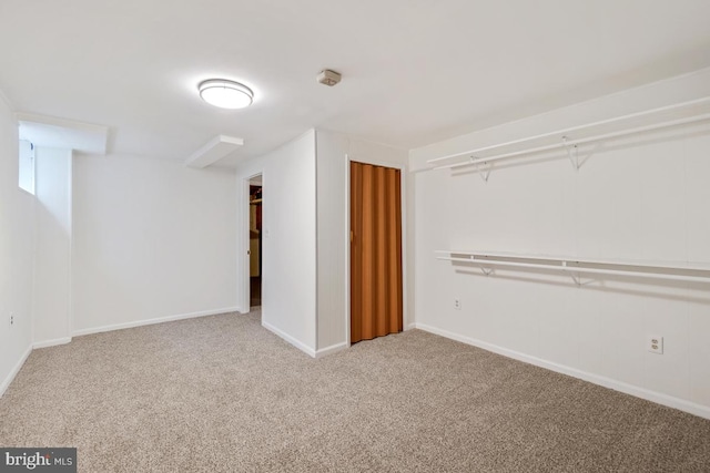 below grade area with carpet floors and baseboards