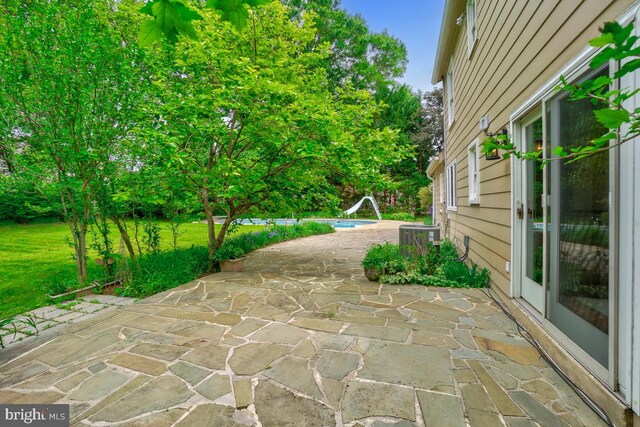 view of patio / terrace with central AC
