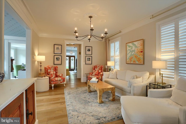 65 S College St, Carlisle, PA 17013 - living room with a chandelier, light wood finished floors, and ornamental molding