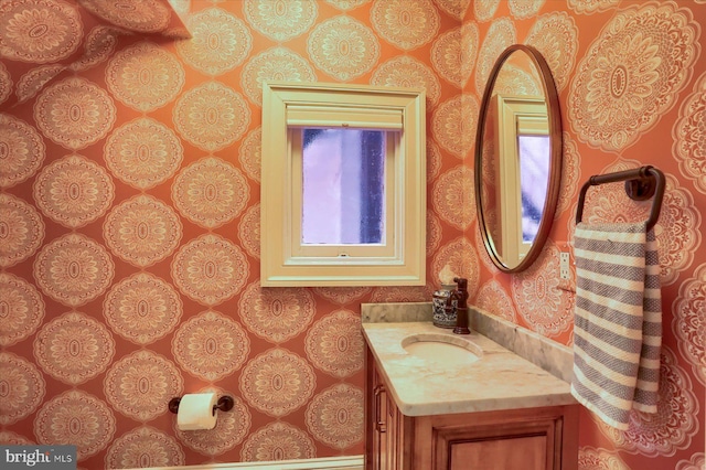 65 S College St, Carlisle, PA 17013 - half bathroom with vanity and wallpapered walls