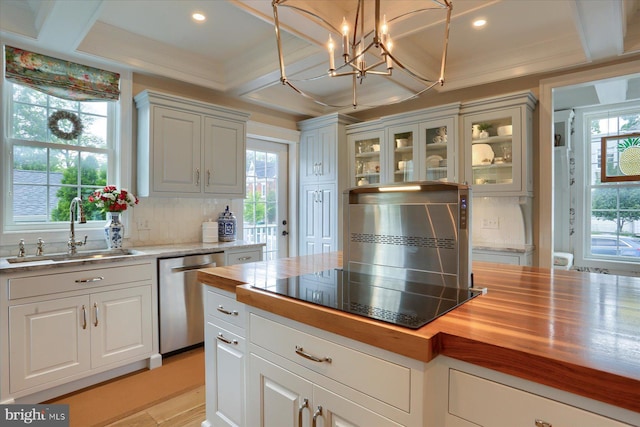 65 S College St, Carlisle, PA 17013 - kitchen with stainless steel dishwasher, a sink, butcher block counters, tasteful backsplash, and beam ceiling
