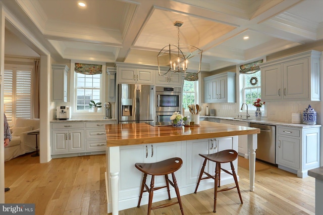 65 S College St, Carlisle, PA 17013 - kitchen with wooden counters, stainless steel appliances, coffered ceiling, a sink, and light wood-style flooring